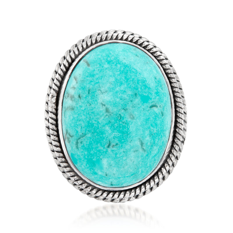 Sterling silver ring with turquoise oval cabochon and braided bezel