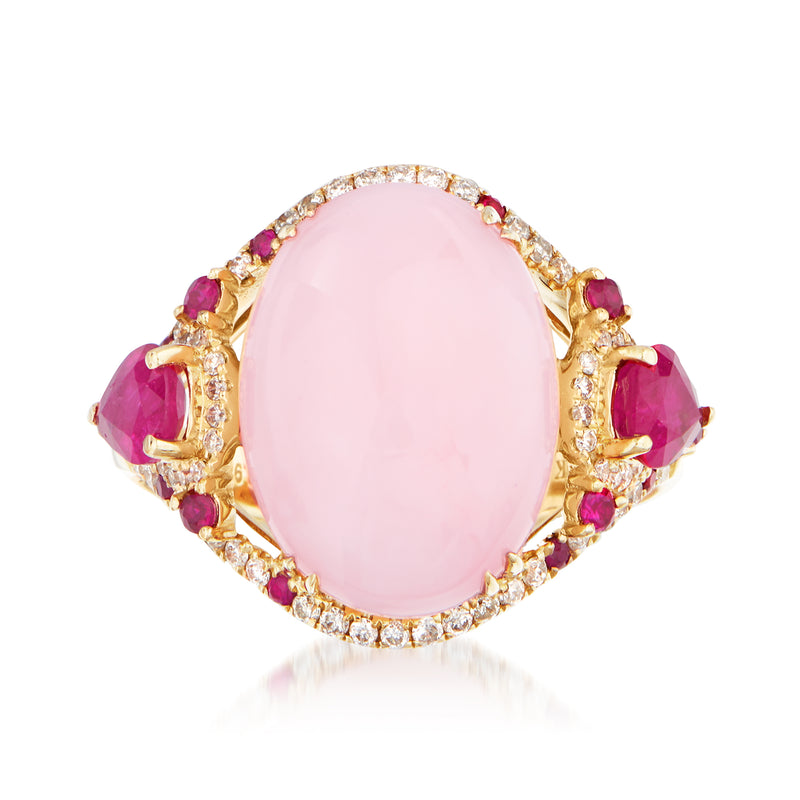 14kt yellow gold ring with oval pink gemstone, diamond halo and purple side stones