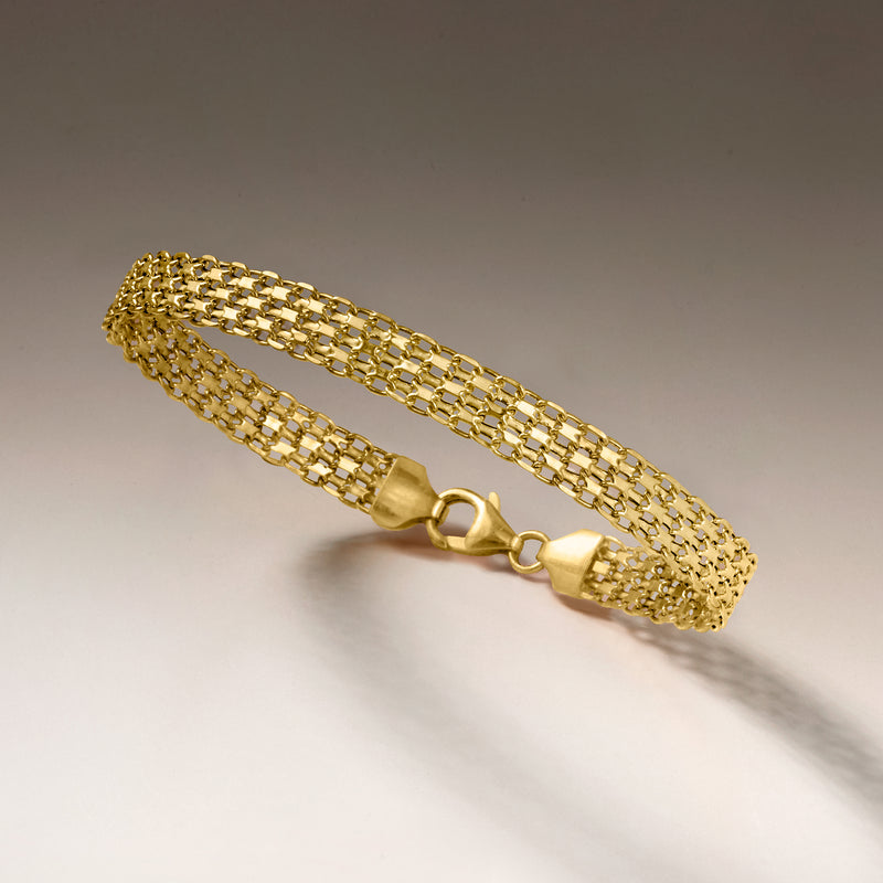 Italian 18kt yellow gold Bismark-link bracelet on smooth surface with round clasp