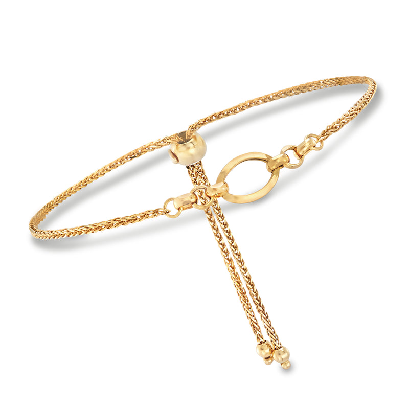 Italian 14kt yellow gold open oval bolo bracelet with braided cord and dangling ends