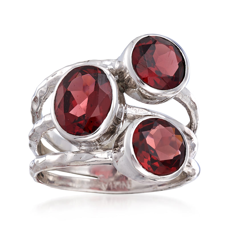 Multi-row sterling silver ring with three oval dark red garnet gemstones