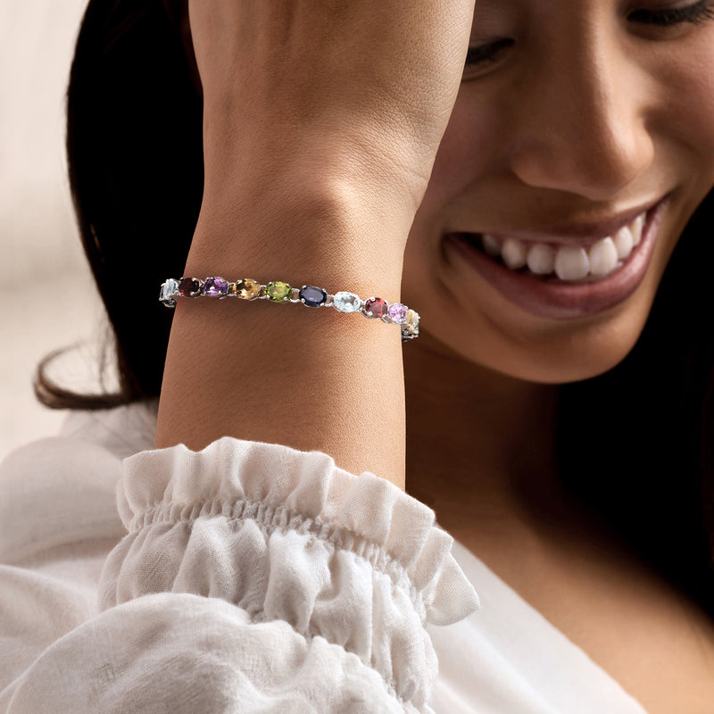 Sterling silver bracelet with multicolor gemstones on wrist