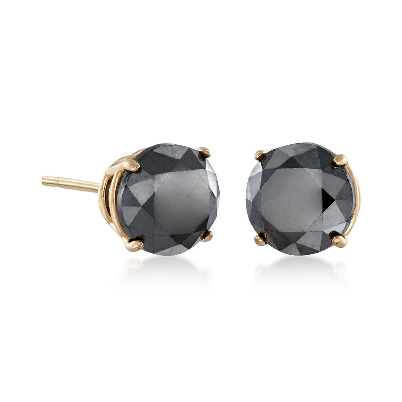 Black diamond stud earrings with yellow-gold prong settings, round faceted stones