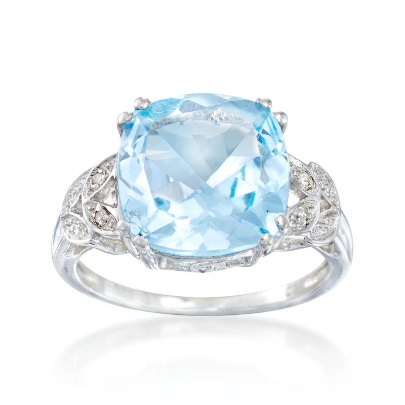 Sterling silver ring with large light blue topaz center and diamond-like side accents