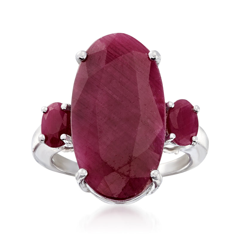 Sterling silver three-stone ruby ring with oval center and round side gemstones
