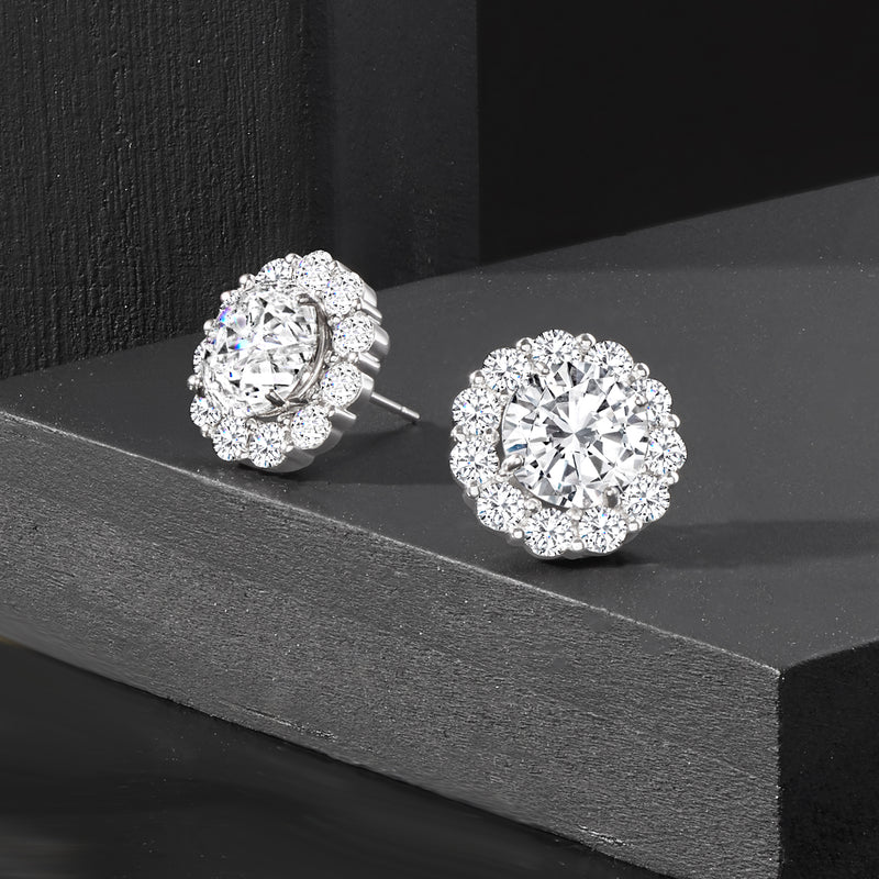 Pair of round diamond earring jackets with center stones, white gold posts