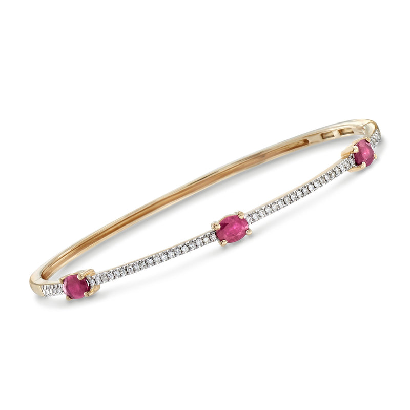 14kt yellow gold bracelet with purple oval ruby and diamond pave row links