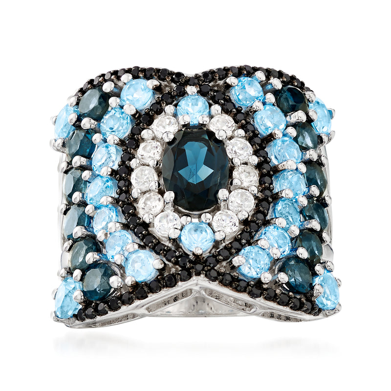 Sterling silver ring with oval blue spinel center, blue topaz and white zircon halo