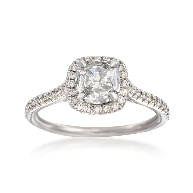 18kt white gold diamond engagement ring with oval center stone and halo accents