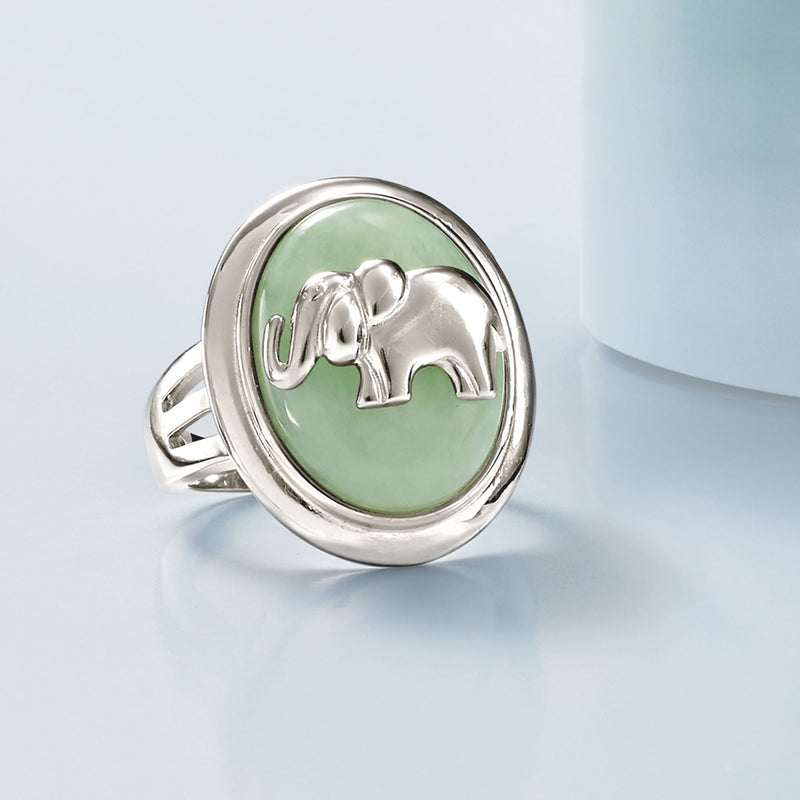 Sterling silver ring featuring oval green jade stone and elephant charm detail