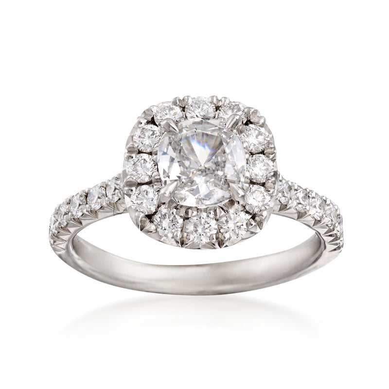Platinum diamond engagement ring with large center emerald-cut and halo of round stones