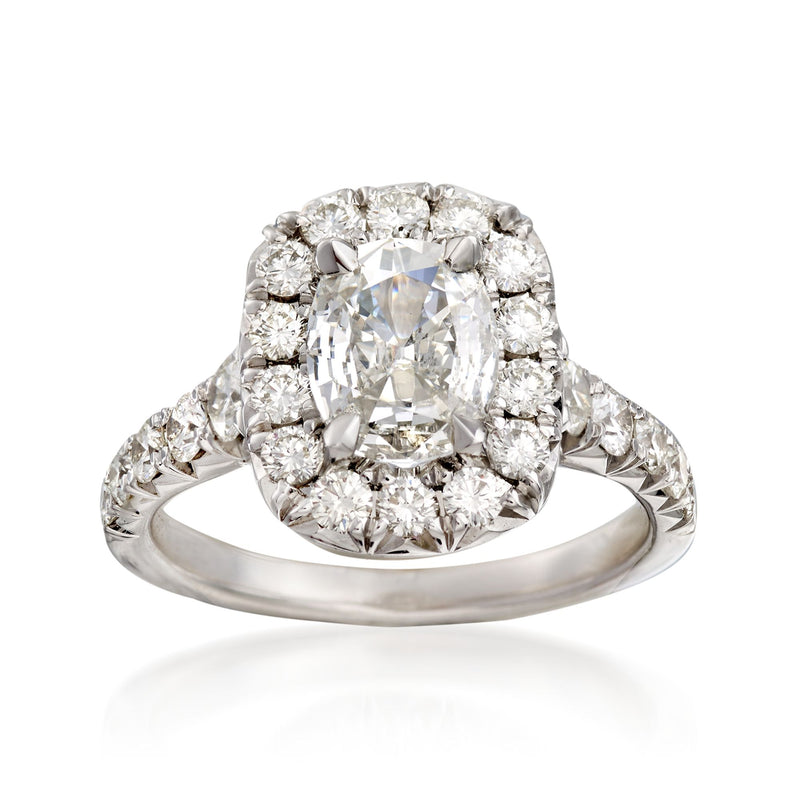 18k white gold diamond engagement ring with cushion-cut center and halo