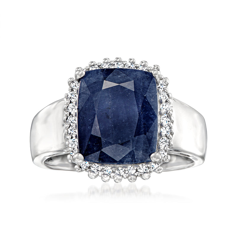 Sterling silver ring with cushion-cut blue sapphire center and white stone halo