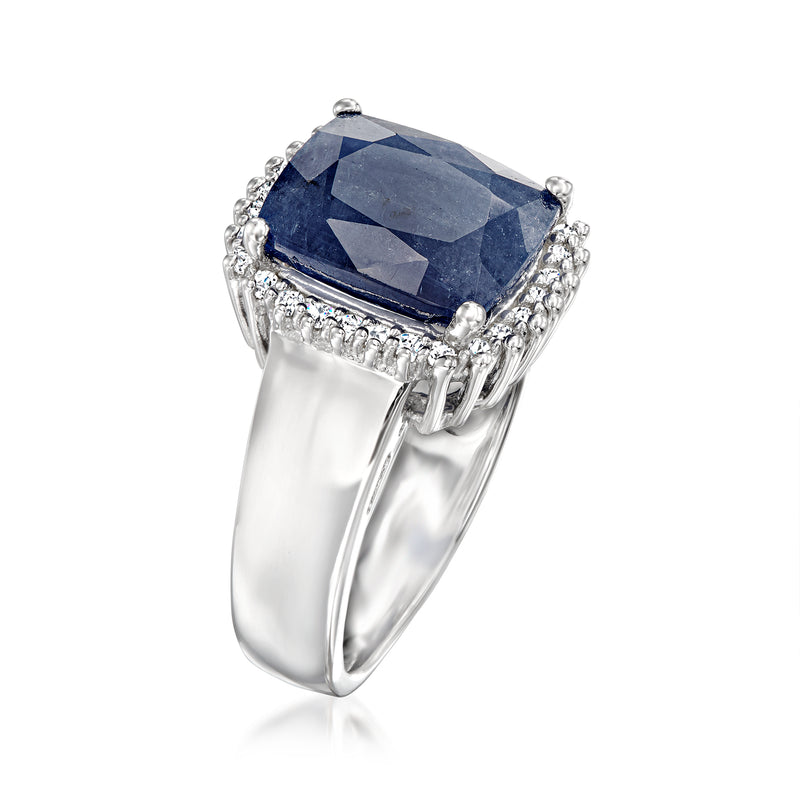 Sterling silver ring with blue sapphire centerpiece, prong-set halo of white stones