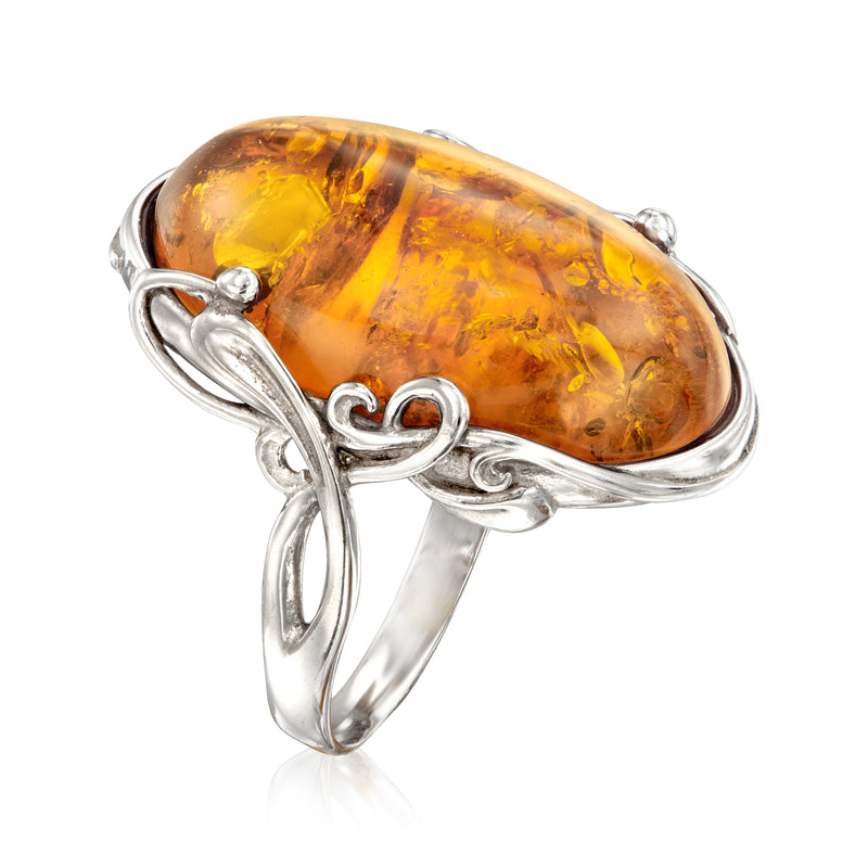 Orange amber oval ring with sterling silver twisted prongs and open band