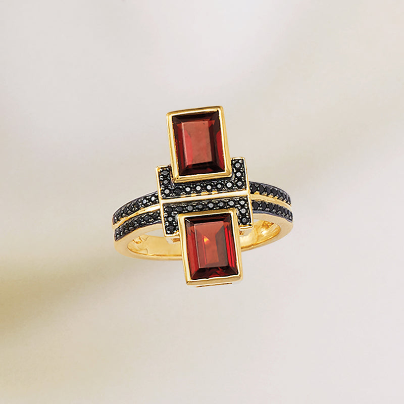 Gold over sterling ring with two rectangular garnet stones and black spinel accents