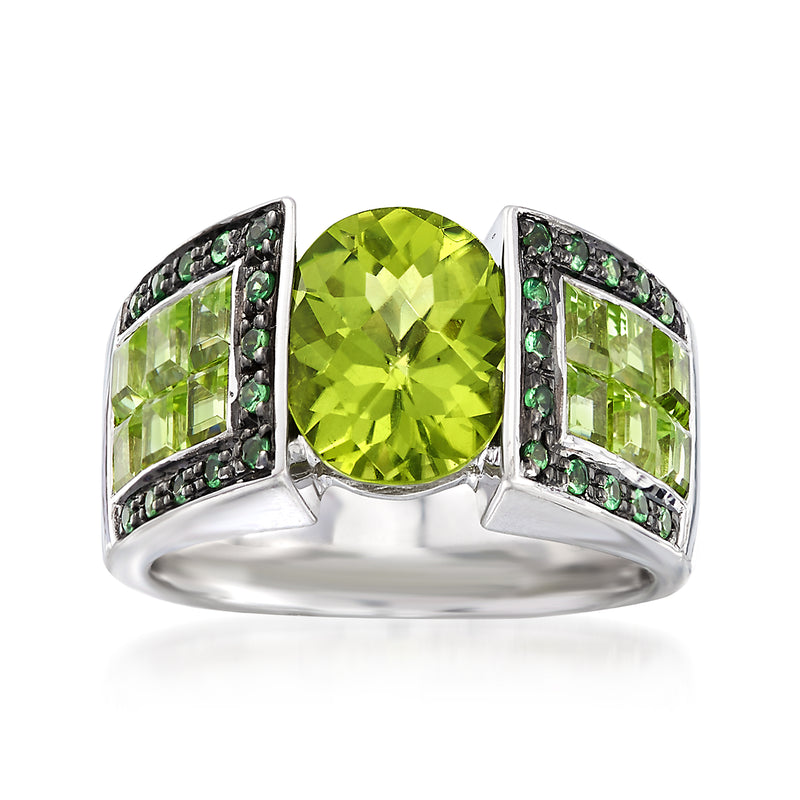 Sterling silver ring with large round peridot-green center and side green gemstone panels