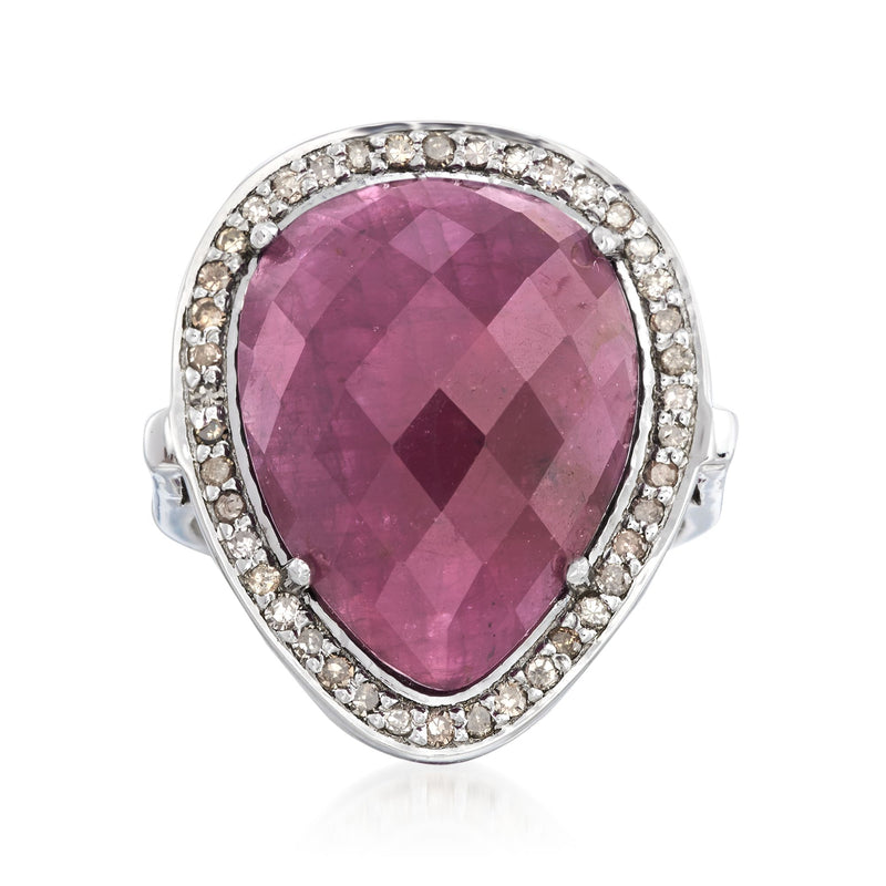 Sterling silver ring with pear-cut pink sapphire and diamond halo