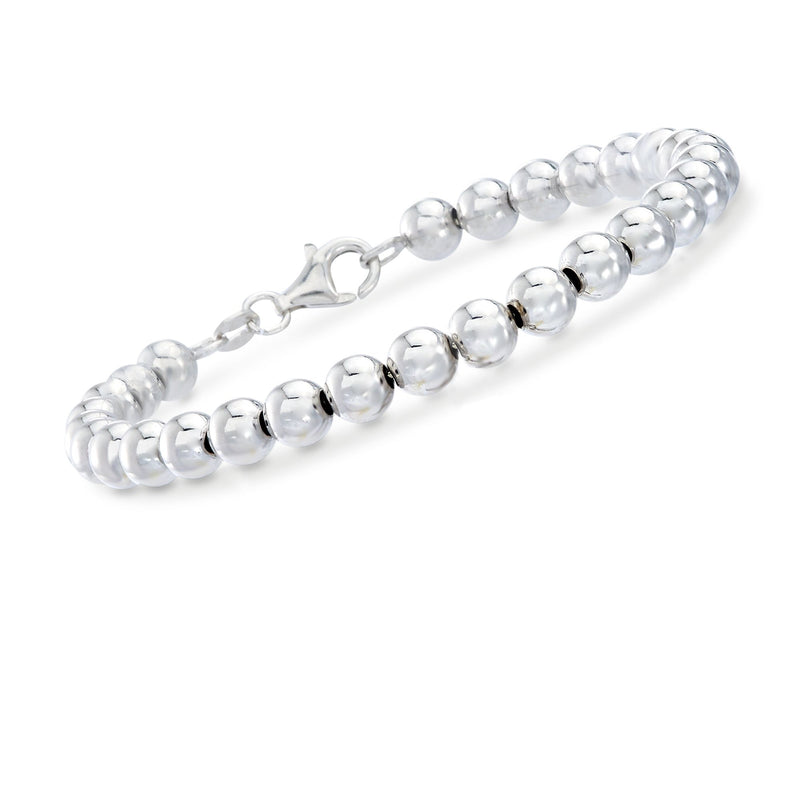 Sterling silver bead bracelet with small dark insets and chain extender