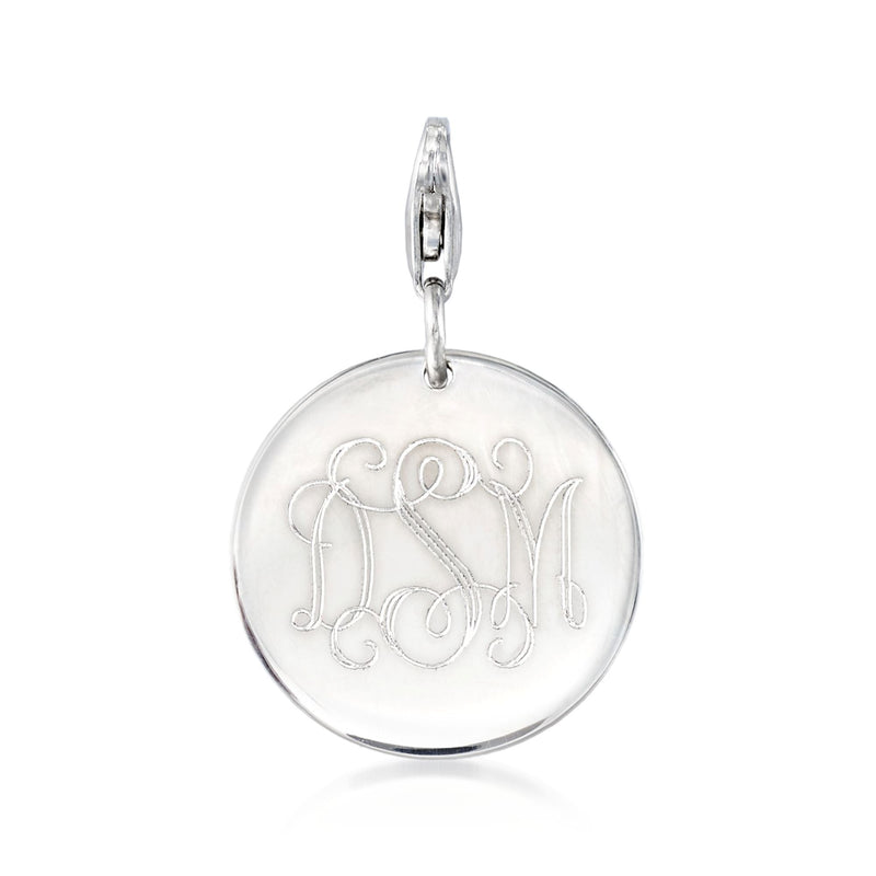 Round sterling silver disc charm with engraved monogram, hanging on a bail