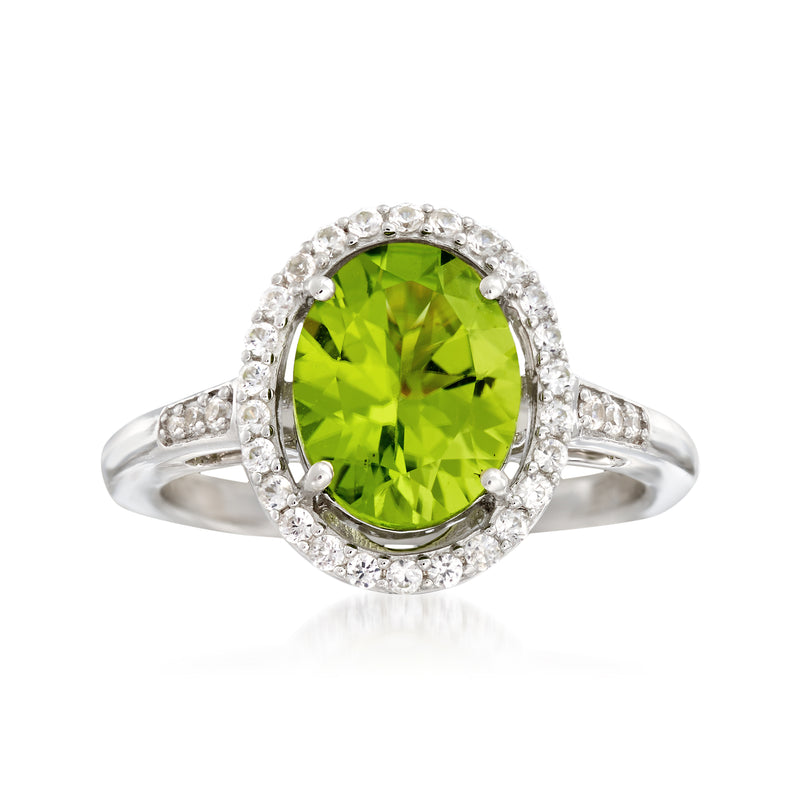 Sterling silver ring with oval peridot center and white zircon halo, split shank