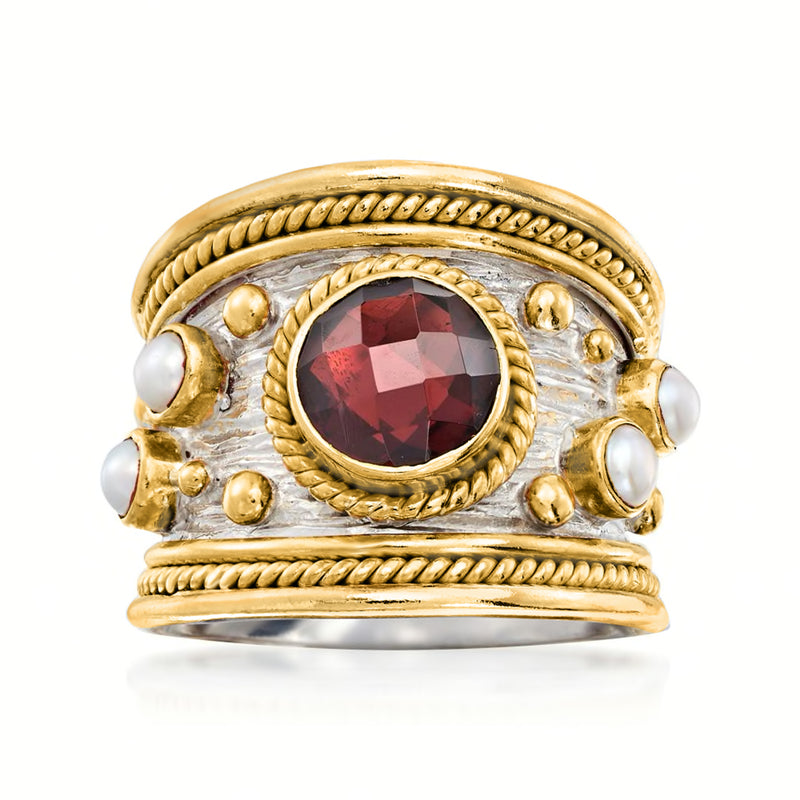 Garnet ring with gold bezel and rope border, red faceted stone with small pearls, two-tone