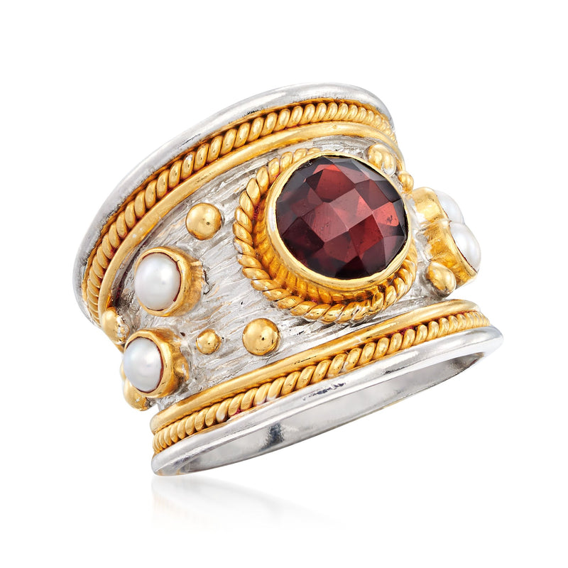 Two-tone sterling ring with red garnet centerpiece and white pearls set around, gold rope edging