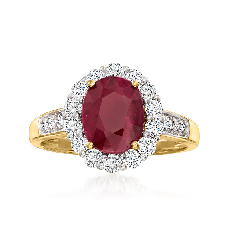 18k yellow gold ruby and diamond ring with oval ruby center halo