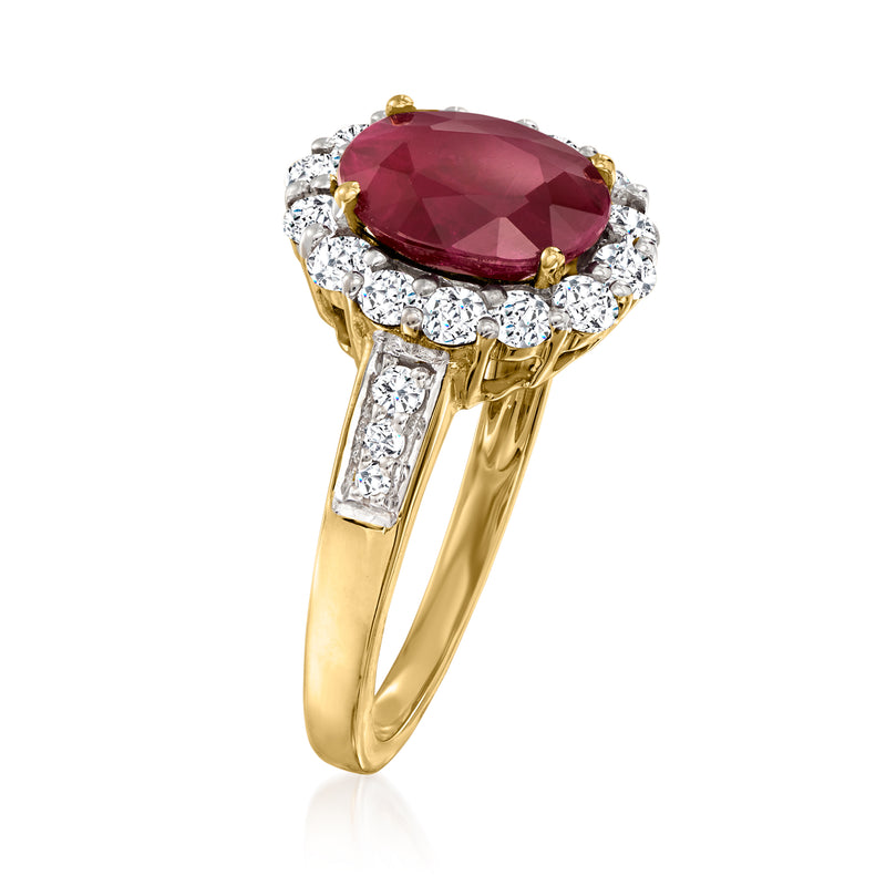 18k yellow gold ruby and diamond ring, oval ruby with halo and diamond side stones