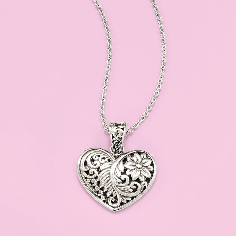 Sterling silver heart pendant necklace with etched scrollwork and central flower