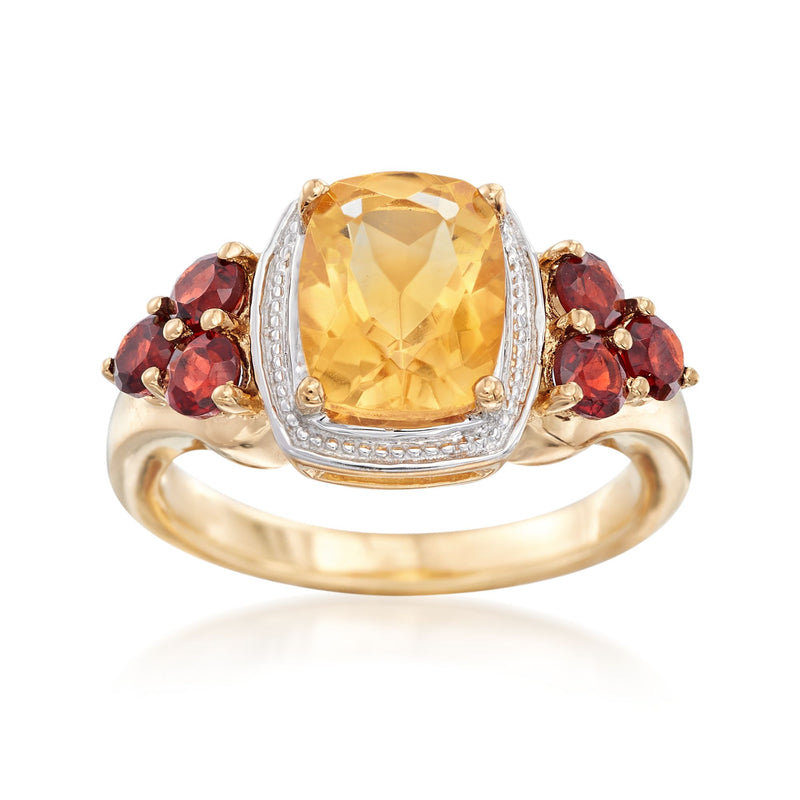 Two-tone sterling silver ring with oval citrine center and burgundy garnet side stones
