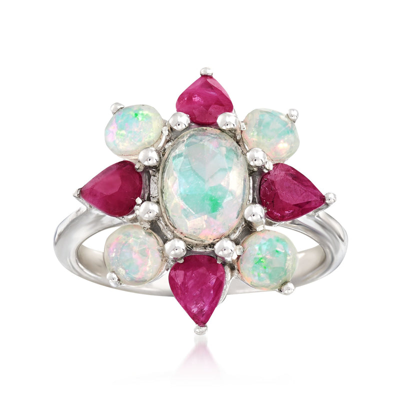 Sterling silver flower ring with oval opal center and ruby red petal accents