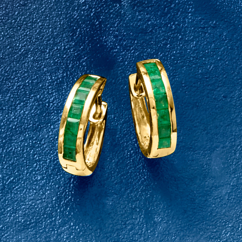 Yellow gold huggie hoop earrings with green gemstone inlay, side view
