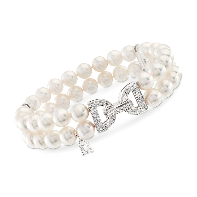 Mikimoto Akoya pearl bracelet with diamond bow clasp and dangling M charm, 18kt white gold