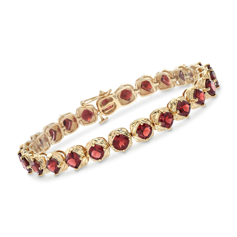 Garnet tennis bracelet with red oval stones in 18kt yellow gold over sterling silver