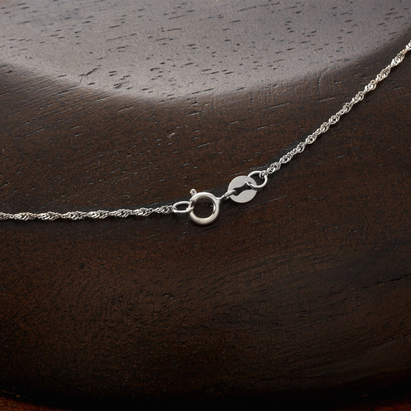 Sterling silver necklace clasp and chain links, Roman numeral pendant detail