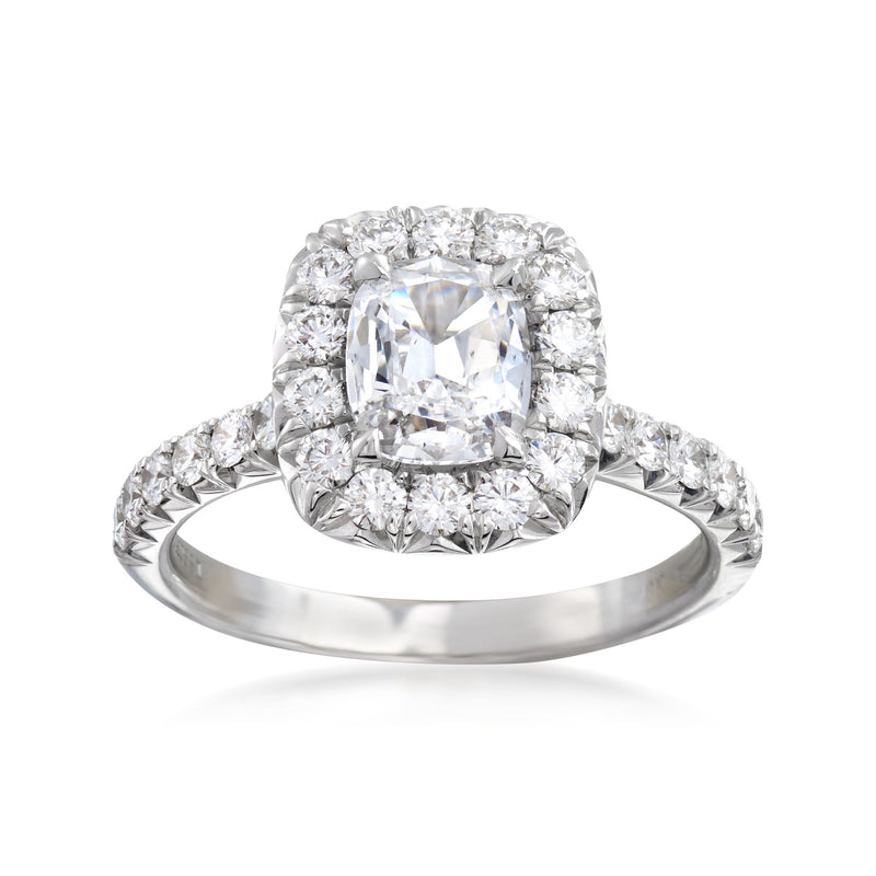 White gold diamond engagement ring with square halo and prong-set center stone