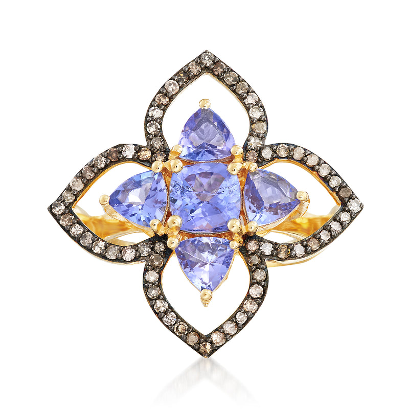 Gold ring with oval purple gemstone center, four leaf-like stones, diamond halo