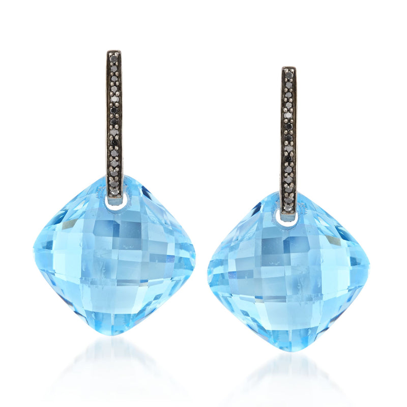 Sterling silver hoop earrings with black diamond accents and faceted blue topaz drops