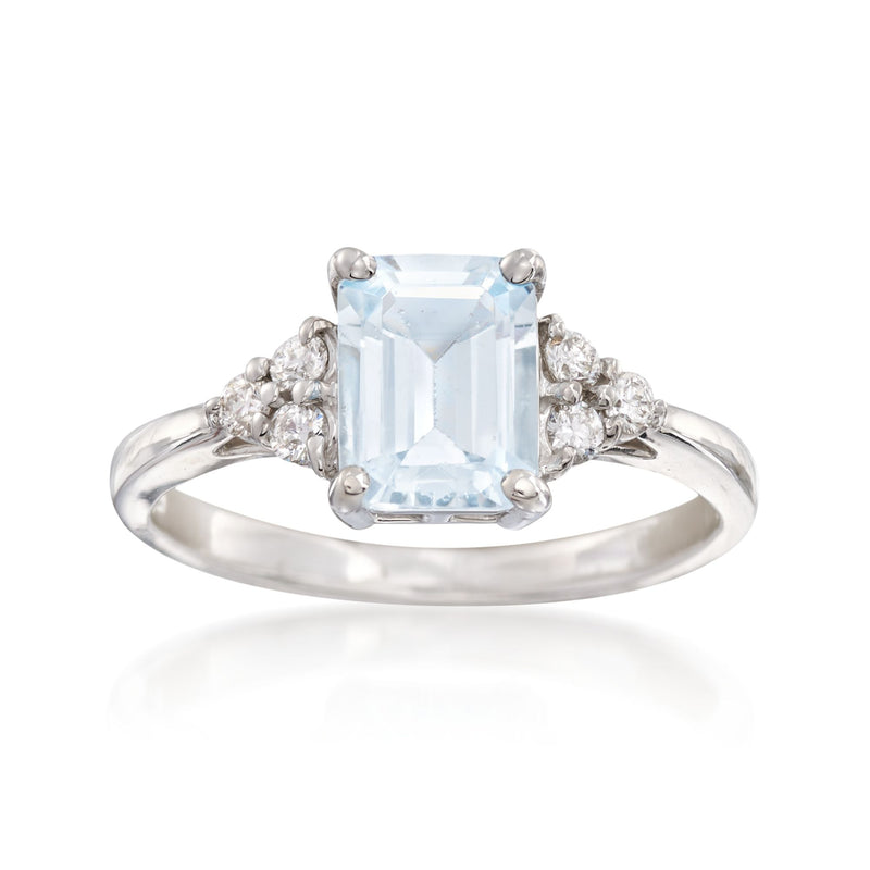 14kt white gold ring with light blue aquamarine and diamond side clusters