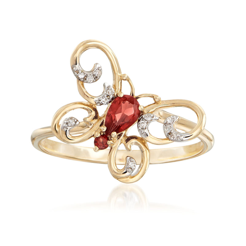14kt yellow gold butterfly ring with red garnet center and diamond accents