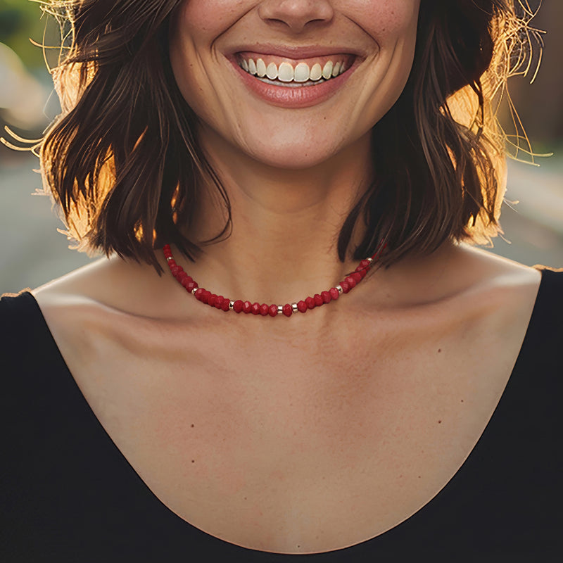 Red coral bead necklace with 14kt yellow gold bead spacers on neckline
