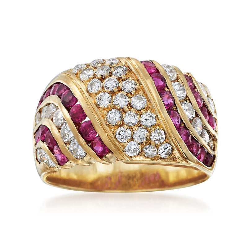 Wide 18k yellow gold ruby and diamond cluster ring with oval diamond center.