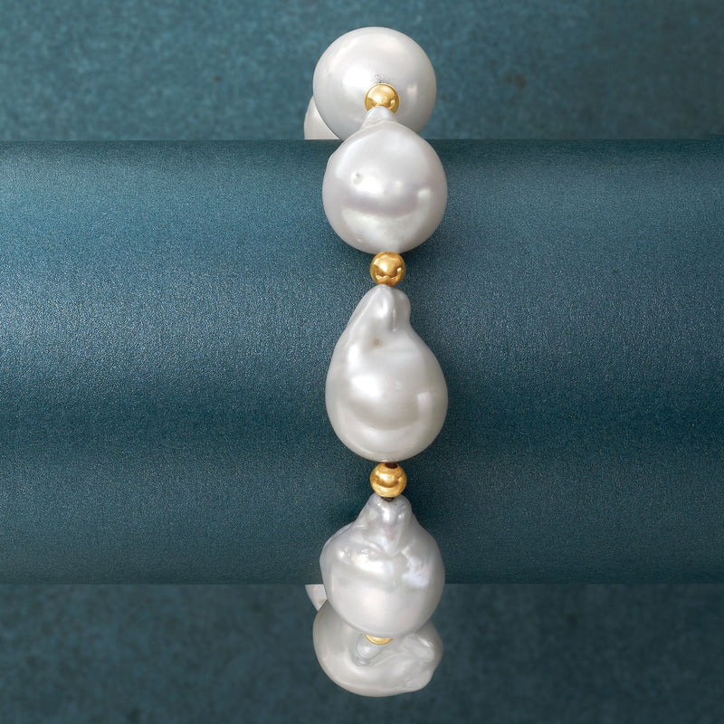 Cultured baroque pearl stretch bracelet with yellow gold bead separators, close-up