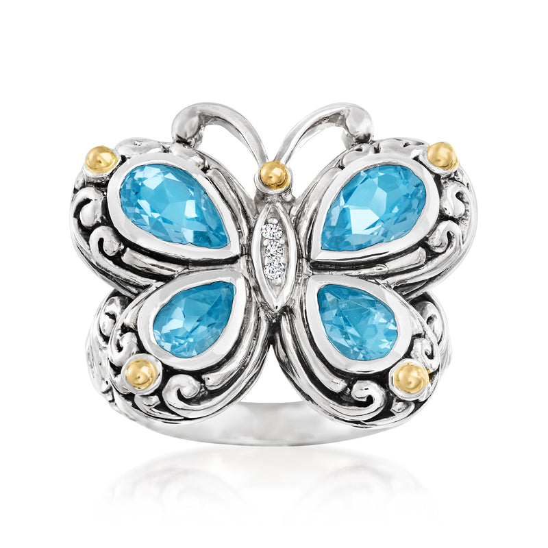 Sterling silver butterfly ring with three blue topaz stones and small gold accents