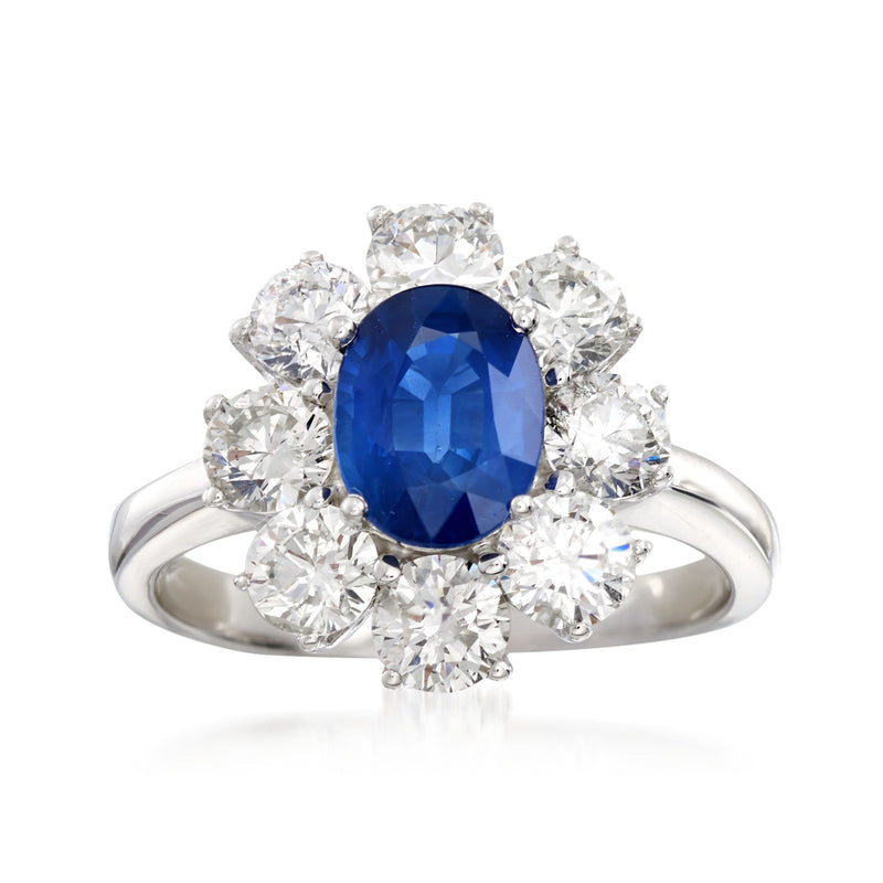 14kt white gold ring with oval blue sapphire center and diamond floral halo