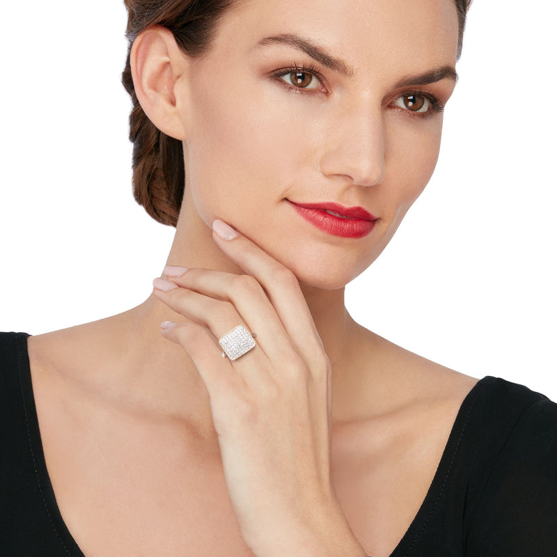 Square-top CZ ring in sterling silver and gold, worn on finger