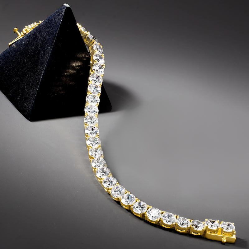 Curved tennis bracelet with bezel-set round CZ stones on gold links