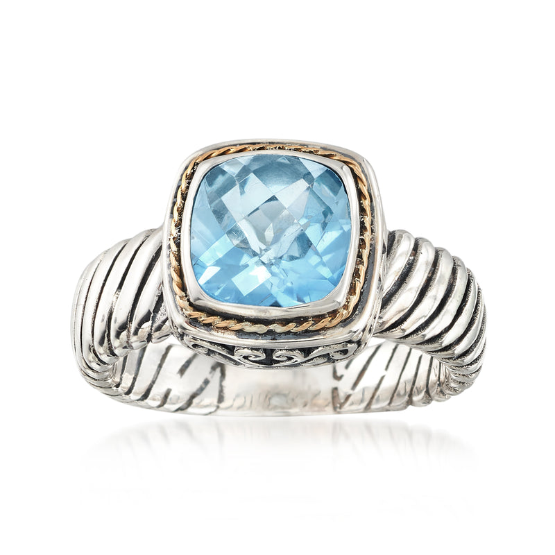 Two-tone sterling silver Bali-style ring with sky-blue topaz center stone