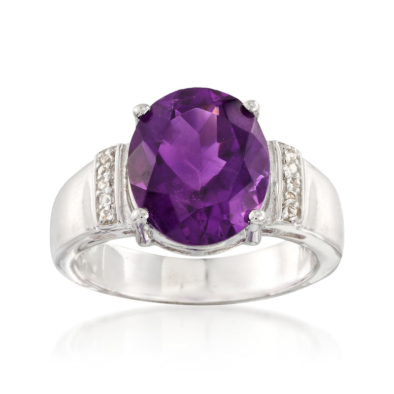 Sterling silver ring with large purple amethyst oval center and clear white stone accents
